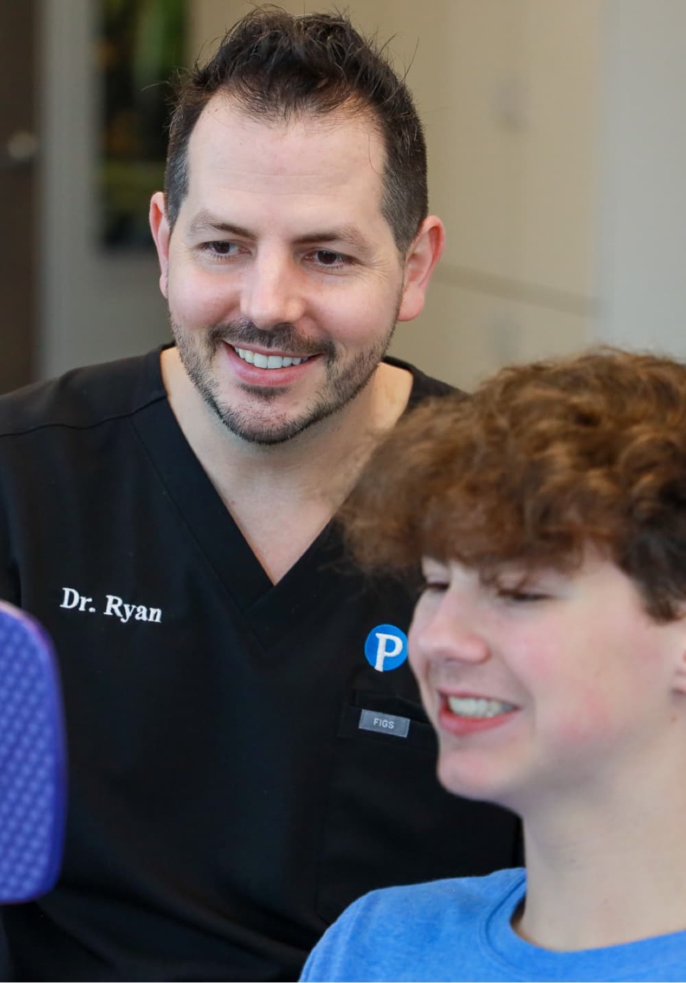 Dr. Pendleton and teen patient smiling