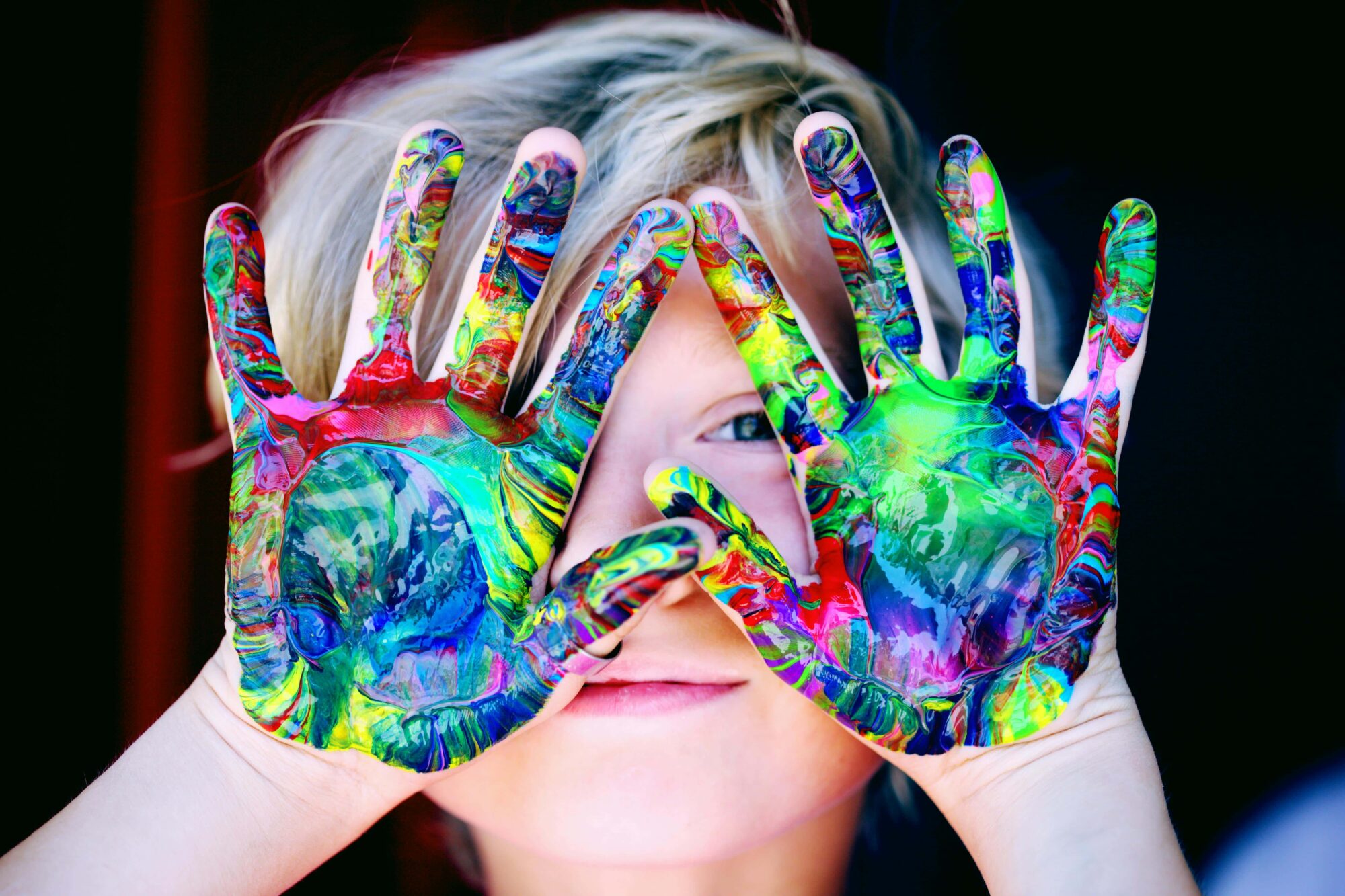 child finger painting